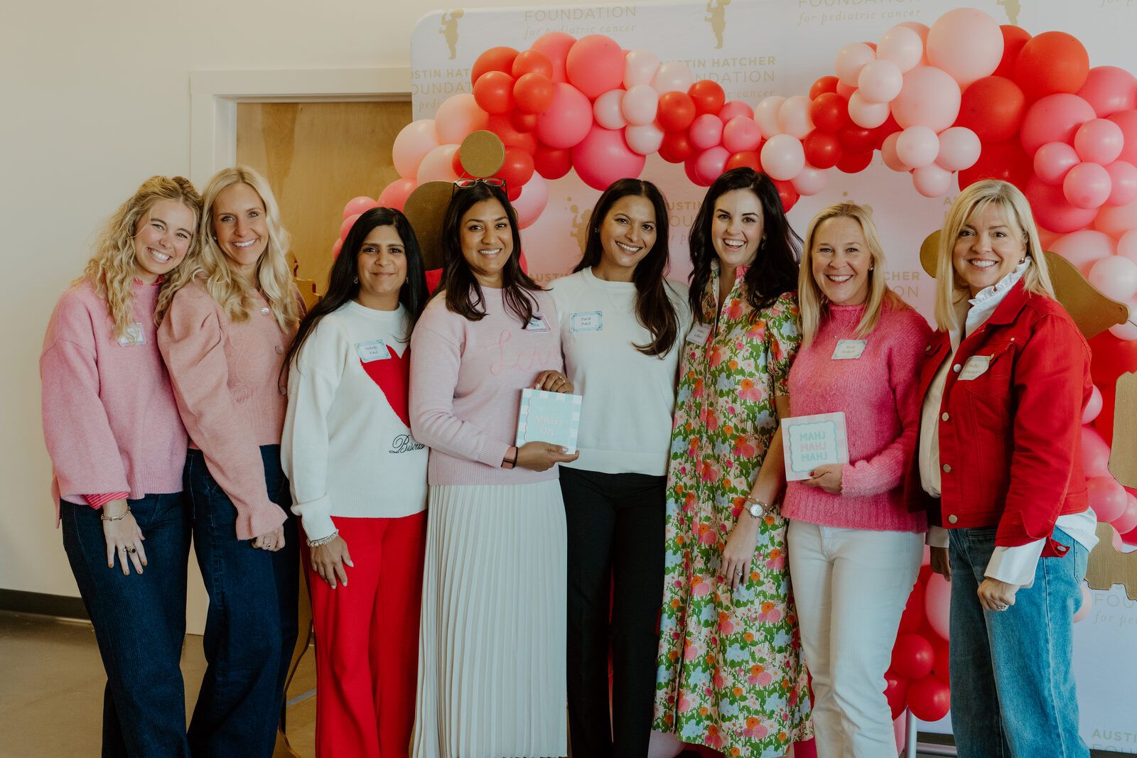 Mahj For A Cause group photo with balloon arch