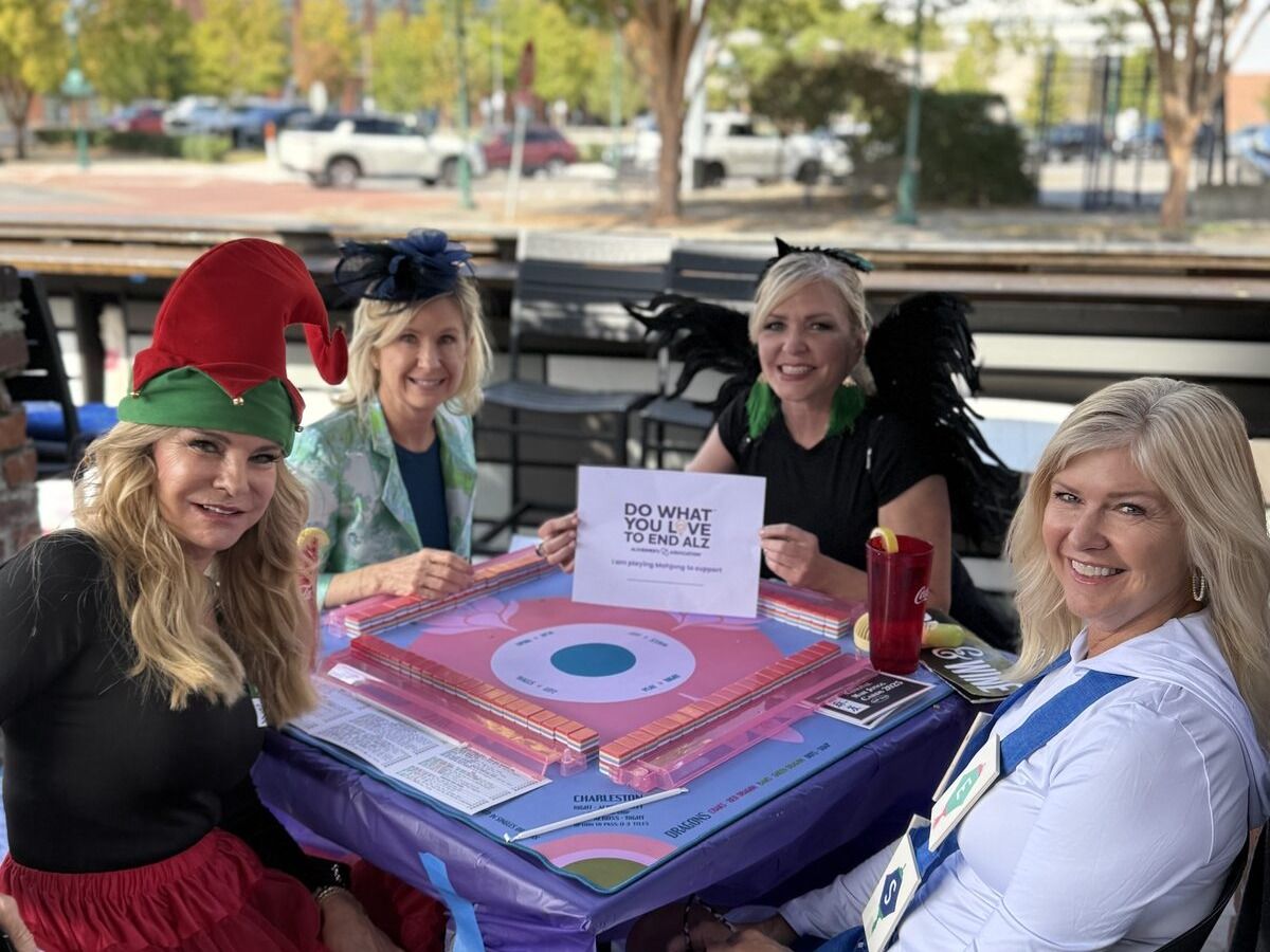Mahj For A Cause players in festive costumes at outdoor patio event